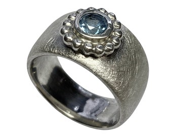 Silver ring with a faceted topaz, handmade