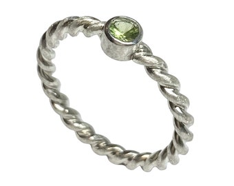 Cord ring with light green peridot, handmade