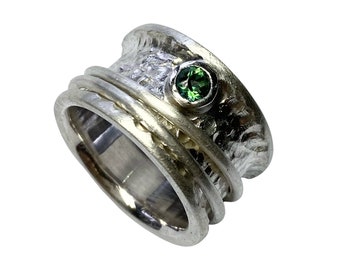 Rotating ring with green topaz, goldsmith's work