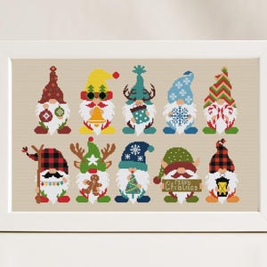 May include: A set of 10 cross-stitch patterns featuring gnomes in various festive attire, including a reindeer, a gingerbread man, a snowman, and a Christmas tree. The gnomes are wearing hats and scarves in red, green, blue, and white.