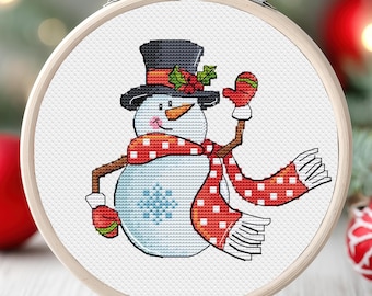 May include: A white snowman with a red and white polka dot scarf and a black top hat with a green holly sprig. The snowman is wearing red mittens and has a carrot nose. The snowman is waving with one arm.