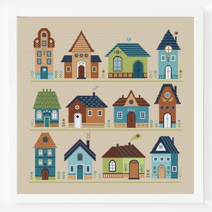 May include: A cross-stitch pattern depicting a row of 10 colourful houses, each with a unique architectural style. The houses are in shades of blue, green, brown, and white, with details such as windows, doors, and roofs.
