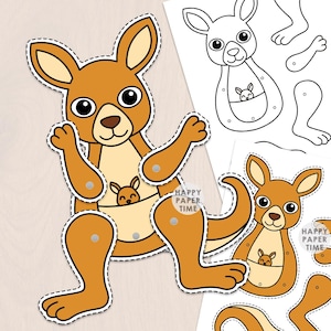 Puede incluir: Un kit de manualidades en papel que muestra un canguro marrón con una cría en su bolsa, incluyendo un canguro ensamblado con extremidades móviles unidas por broches plateados y dos hojas impresas con piezas de canguro a color y en blanco y negro.