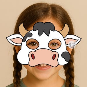 May include: A white cow mask featuring black spots, tan horns, and a pink muzzle. The mask has two eye cutouts and a small circular logo on the right side that reads HAPPY PAPER TIME. The design is flat with bold black outlines and cartoon features.