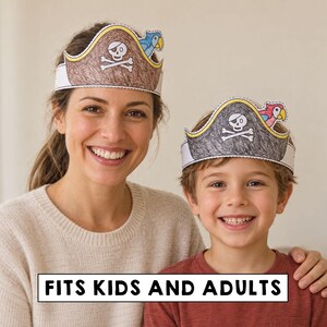 May include: Two paper pirate hats featuring a skull and crossbones design with a colourful parrot attached to the side. The hats are coloured with brown and black crayon textures. The text FITS KIDS AND ADULTS is printed in black on a white background.