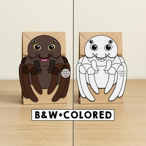 May include: Two brown paper bags each featuring a cartoon spider design. One spider is colored brown with yellow eyes, the other is a black and white outline. The text "HAPPY PAPER TIME" is on each bag. The text "B&W+COLORED" is at the bottom.