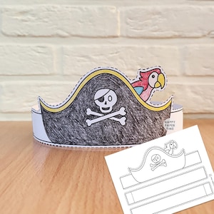 May include: A paper pirate hat craft featuring a black-colored hat with a white skull and crossbones emblem and a colorful parrot. The hat includes a yellow trim and is displayed alongside a flat, uncolored paper template with the text HAPPY PAPER TIME.