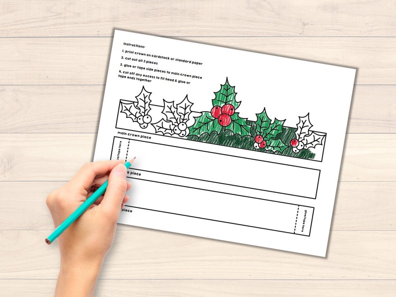 May include: Printable Christmas holly crown craft template. The template includes instructions to print, cut, and assemble the crown. The crown features holly leaves and red berries.