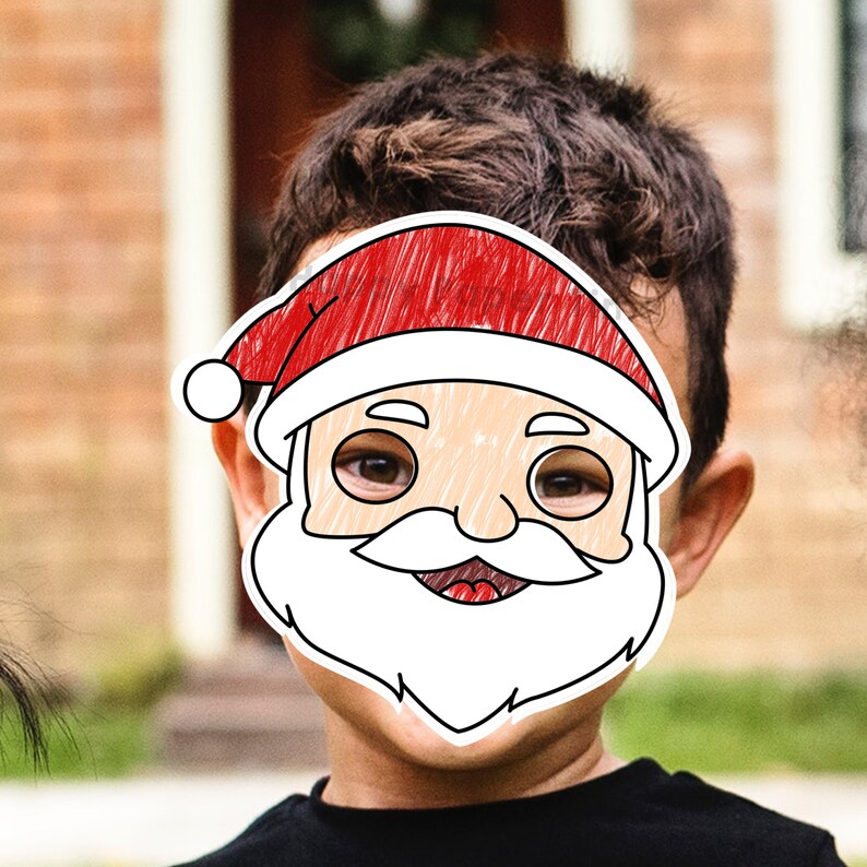 May include: A child wearing a Santa Claus face mask. The mask is a cartoon drawing with a red hat, white beard, and a smiling face. The child is wearing a black top.