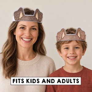 May include: Two paper crowns featuring brown dog ears with tan inner details and a white border. The crowns are designed to be worn around the head. The text FITS KIDS AND ADULTS is printed in black on a white rectangular background at the bottom.