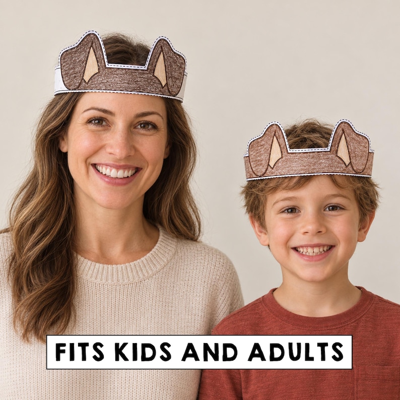 May include: Two paper crowns featuring brown dog ears with tan inner details and a white border. The crowns are designed to be worn around the head. The text FITS KIDS AND ADULTS is printed in black on a white rectangular background at the bottom.