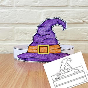 May include: A paper witch hat crown colored in purple with an orange band and a yellow buckle, featuring a dashed cutting line along the edges. Beside it lies a black and white printable template sheet with the text Happy Paper Time.