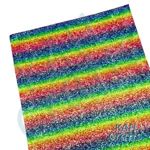 May include: Rainbow glitter fabric with a holographic finish. The fabric has a striped pattern with alternating colors of red, orange, yellow, green, blue, indigo, and violet. The fabric is perfect for crafting projects.