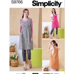 May include: Simplicity sewing pattern S9766. The image shows three different apron designs. One is a black and white patterned apron over a pink long-sleeve shirt. The other two are solid color aprons in pink and orange. The aprons are easy-to-sew.