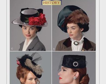 May include: A vintage hat pattern from Butterick, featuring four different hat designs. The hats include a silver-brimmed hat with red flowers, a green hat with feathers, a black hat with a veil and a black hat with a decorative circle.