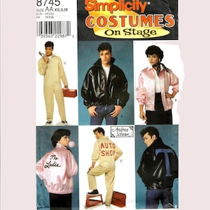 May include: Simplicity Costumes on Stage pattern. The image shows various costume designs, including a black leather jacket, a pink satin jacket with "The Ladies" text, and a tan jumpsuit with "AUTO SHOP" text. The pattern number is 8745.