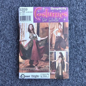 May include: Simplicity costume pattern for adults, featuring three costume designs. The pattern cover has the number 5359 and includes sizes 14, 16, 18, and 20. The cover has images of women wearing the costumes.