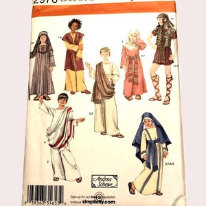 May include: Simplicity sewing pattern 2976 featuring illustrations of historical costumes. The costumes include Roman, biblical, and ancient Greek styles. The pattern includes sizes XS, S, M, and L. The pattern is designed by Andrea Schewe.