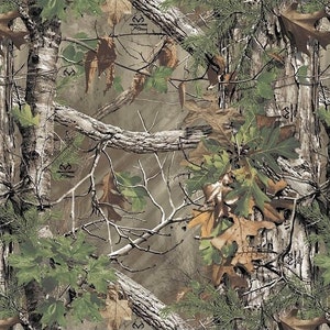 May include: A fabric pattern featuring a realistic Realtree Xtra camouflage design with detailed brown tree bark, textured branches, and a mix of green and brown oak and maple leaves layered over a soft, neutral tan forest background.