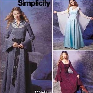 May include: Simplicity sewing pattern envelope featuring three floor-length dresses with long flared sleeves. One dress is dark grey with a black sash, one is light blue with sheer white sleeves, and one is deep red, all with scoop necklines.