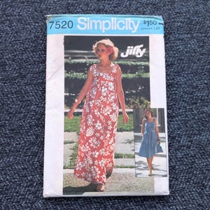 May include: Vintage Simplicity sewing pattern 7520, featuring a woman in a red floral maxi dress. The pattern includes a smaller image of a blue dress. The word "Jiffy" is visible.