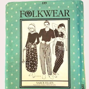 May include: A teal-colored fabric with a white floral pattern and the word "FOLKWEAR" in black. The image features illustrations of three people wearing sarouelles, with the text "SAROUELLES Pants from Turkey, Africa & India" below the illustrations.