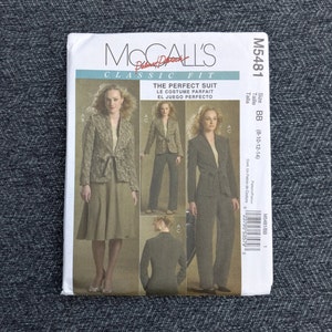 May include: A McCall's M5481 sewing pattern envelope for a classic fit suit. The front displays illustrations of a jacket with a tie-front closure paired with either a skirt or trousers. Text includes "McCall's", "Classic Fit", and "The Perfect Suit".