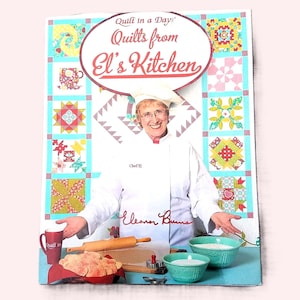 May include: A book cover titled "Quilts from El's Kitchen" featuring a woman in a chef's hat and coat. The cover has a quilt design border with various colorful quilt blocks. The woman is smiling and surrounded by cooking tools and ingredients.