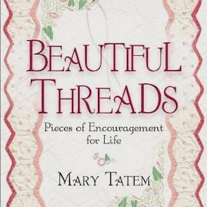 May include: A book cover with the title "BEAUTIFUL THREADS" in burgundy lettering. The design includes a quilted border in pink and cream, floral embroidery, and a needle and thread illustration. The author's name, Mary Tatem, is also displayed.