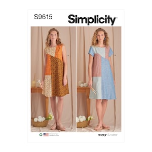 May include: Simplicity S9615 sewing pattern featuring two patchwork dresses. One dress has an orange, brown, and beige color scheme, while the other is blue, pink, and light blue. The pattern is labeled "easy-to-sew."