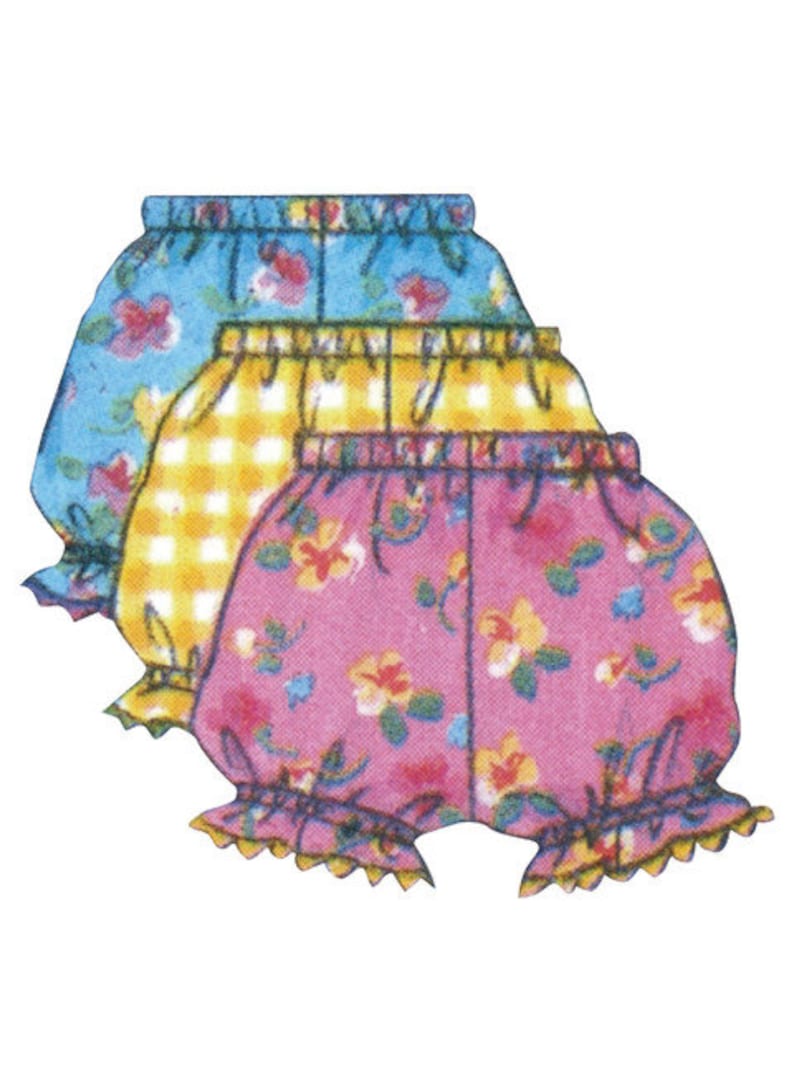 May include: Three pairs of baby bloomers in a stack. The top pair is light blue with a floral pattern, the middle pair is yellow gingham, and the bottom pair is pink with a floral pattern. Each pair has a ruffled hem.