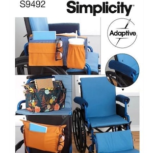 May include: A blue wheelchair with various orange and floral print storage bags and accessories. The image includes the text "Simplicity" and "Adaptive". The accessories include a cup holder, glasses, and a notebook. The text "easy-to-sew" is also visible.