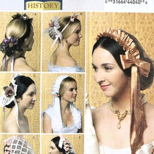 May include: Butterick B5663 sewing pattern featuring historical women's headwear designs. The image showcases various styles, including bonnets, veils, and headbands with floral and ribbon accents. The pattern includes all sizes.