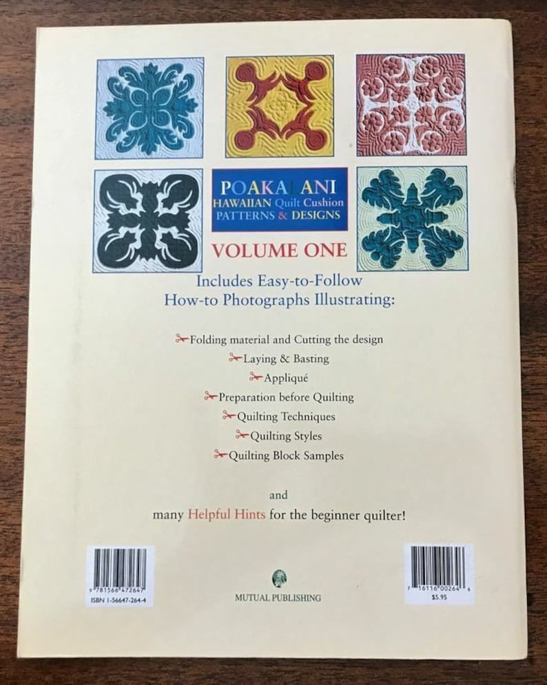 May include: The back cover of a book titled "POAKA ANI Hawaiian Quilt Cushion Patterns & Designs Volume One." It features colorful quilt block designs and includes instructions for quilting techniques. The book is published by Mutual Publishing.