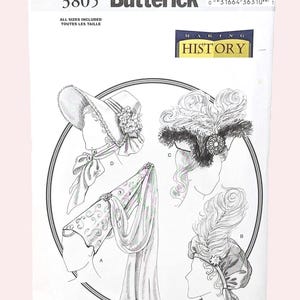 May include: A vintage Butterick sewing pattern, featuring illustrations of historical hats. The pattern cover is white with black text and drawings, including a bonnet, a feathered headpiece, and a draped head covering. The text "Making History" is also visible.