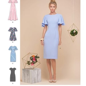 May include: Simplicity pattern 8292 features a woman in a light blue dress with flutter sleeves. The image includes dress illustrations in pink, floral, light blue, and black and white checkered patterns. The Simplicity logo is at the top.