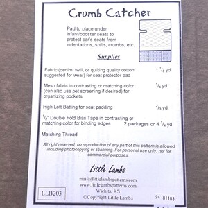 May include: A sewing pattern instruction sheet titled Crumb Catcher for an infant or booster seat protector pad. It lists required supplies including fabric, mesh, batting, and bias tape with specific yardage measurements in inches and yards.