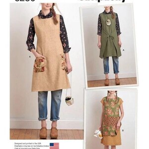 May include: Simplicity pattern 8230 by Dottie Angel features sewing instructions for sleeveless tunics and aprons. The designs include variations with patch pockets, tie-front closures, and floral fabric accents, shown worn over shirts and jeans.