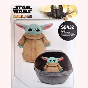 May include: A Star Wars The Mandalorian pattern features a plush Grogu doll in a tan robe with large ears. The pattern includes instructions for a Grogu doll and a gray carrier. The text "S9432 OS" is visible.