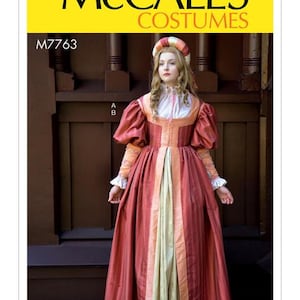 May include: A McCall's Costumes pattern featuring a Renaissance-style dress. The dress is primarily red with cream and peach accents, a high neckline, and puffed sleeves. The pattern includes the text "McCall's Costumes" and "M7763".