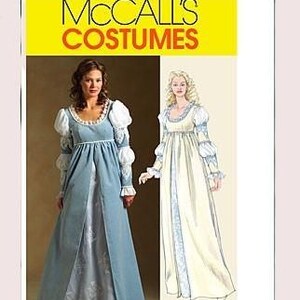 May include: A McCall's Costumes pattern featuring a woman in a light blue and white Renaissance-style gown with puff sleeves. The pattern also shows a drawing of a similar gown. The text "McCall's Costumes" is at the top.