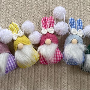 Five bright gingham spring gnomes ready for flowers and warmth!