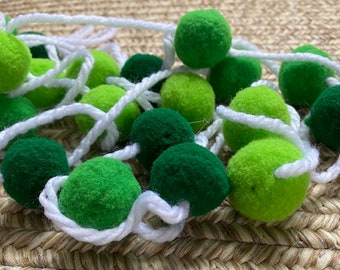 Green pom pom garland in three shades of green