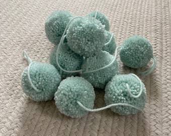 Light teal yarn pom pom garland