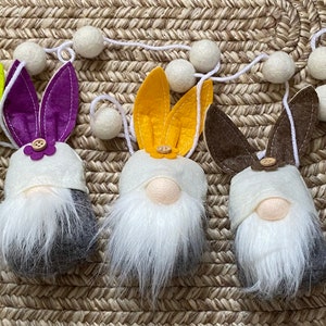 Five bright felt spring gnomes ready for flowers and warmth!