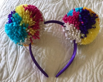 Multicolored yarn bear style double pom pom headband