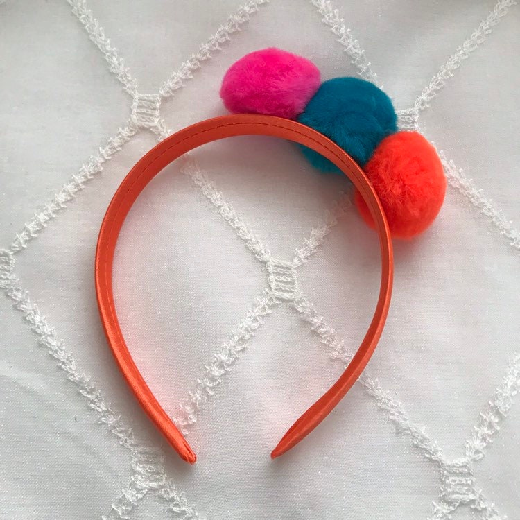 Pink orange and blue pom poms on orange satin covered Etsy