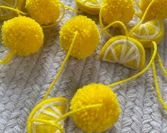 Yellow pom pom and felt lemon pom pom garland