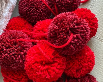 Red and cranberry yarn pom pom garland