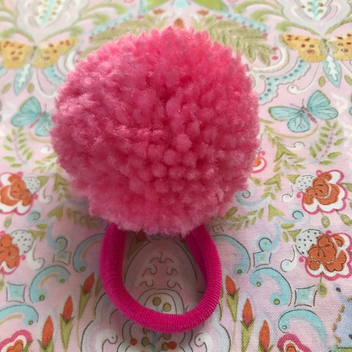 Pretty pink yarn pom pom hair tie Etsy